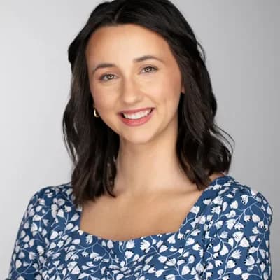 Corporate headshot example — Portland studio (woman leader in blue top)