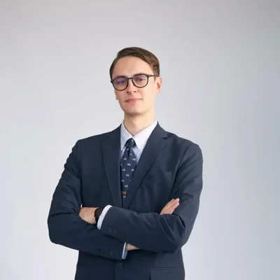 Corporate headshot example — Portland studio (young executive in navy suit)