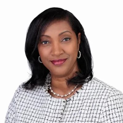 Corporate headshot example — Portland studio (woman in checkered jacket)