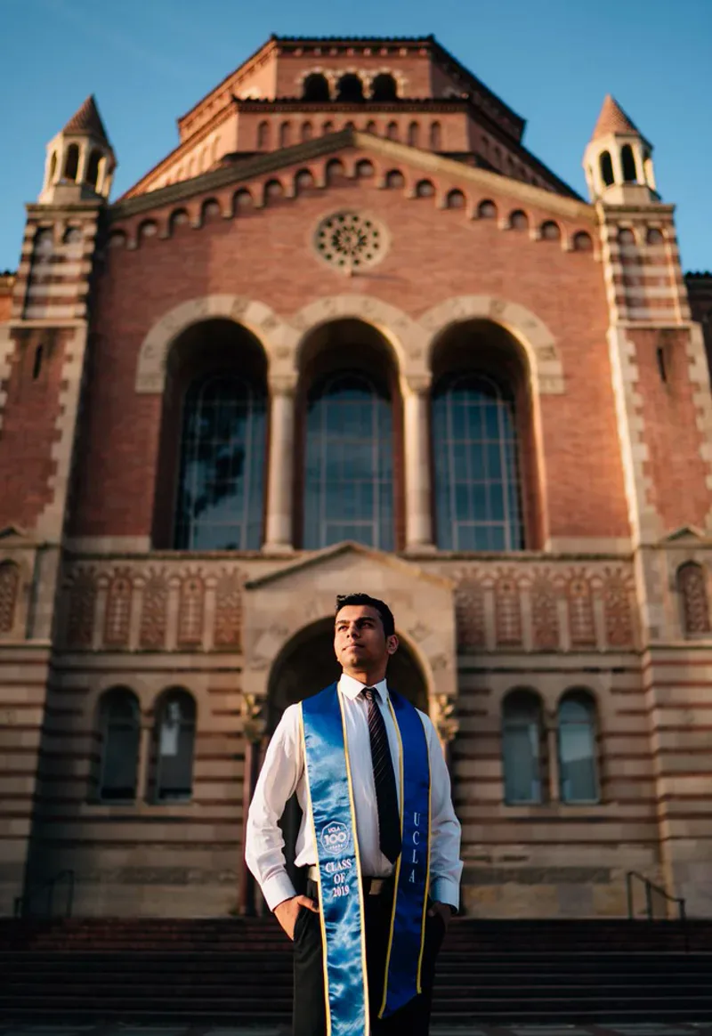 UCLA creative graduation portrait at Powell Library