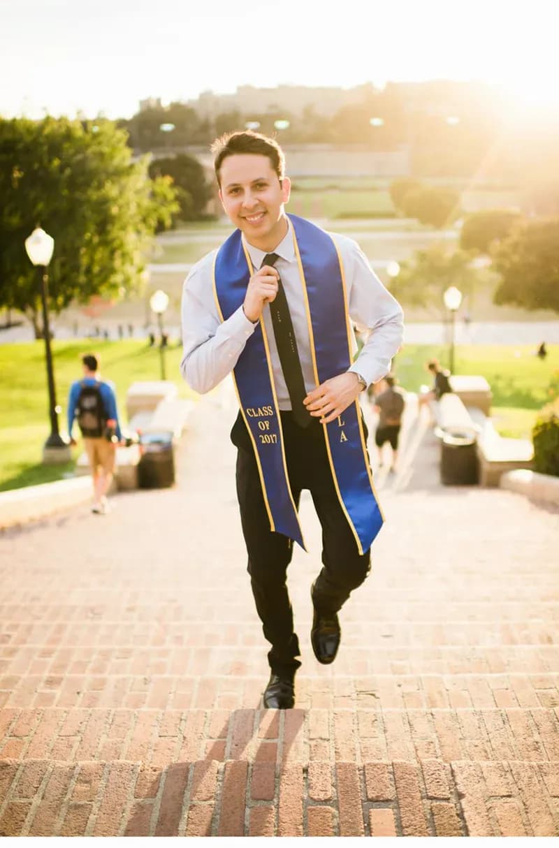 Confident graduate walking Janss Steps at UCLA