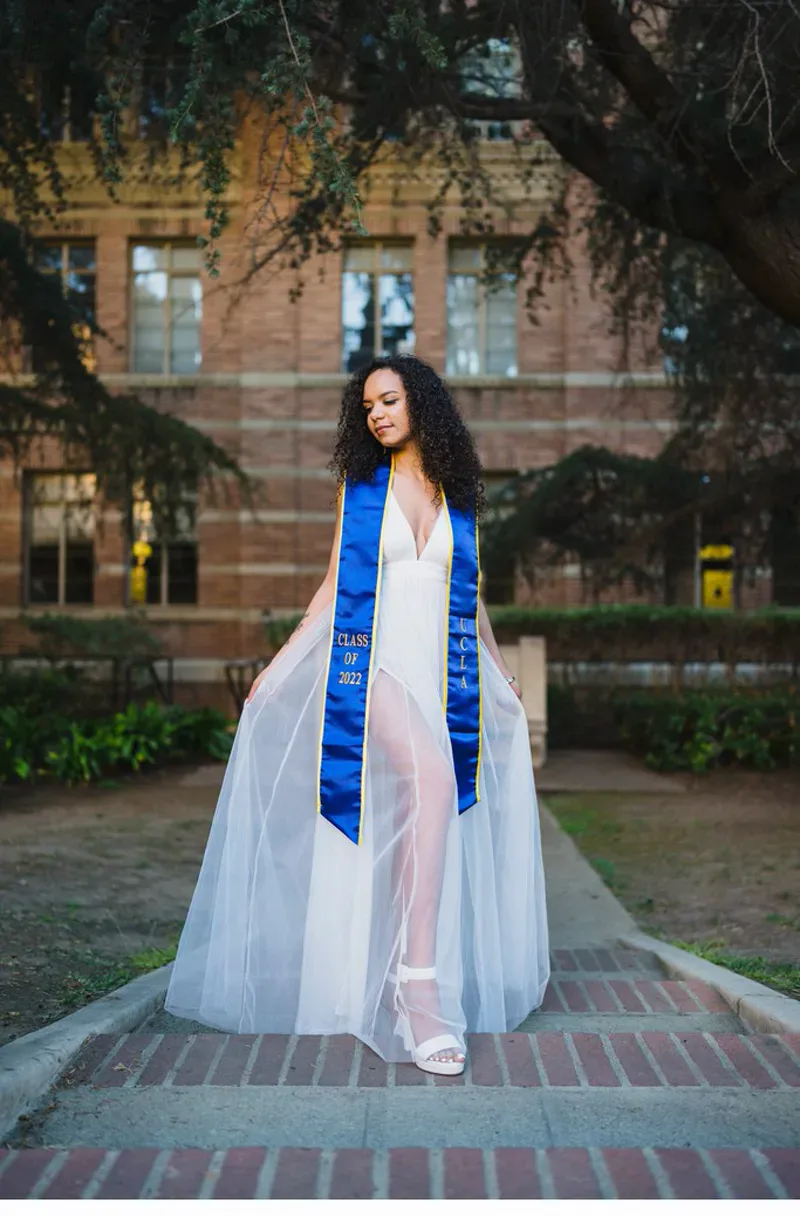 Graduation portrait in long white chiffon dress