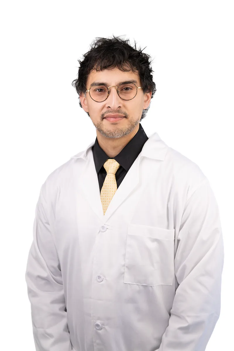 Confident professional headshot of a man in a jacket and open collar