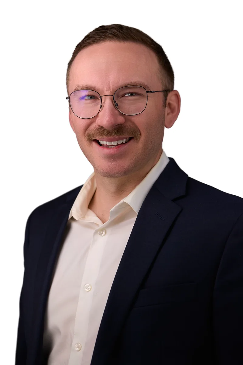 Corporate headshot for a Columbia employee on a neutral studio background