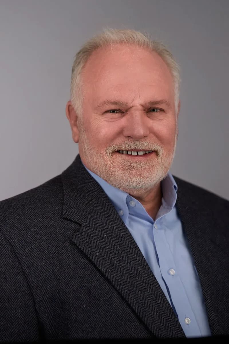 Polished executive headshot with directional studio lighting
