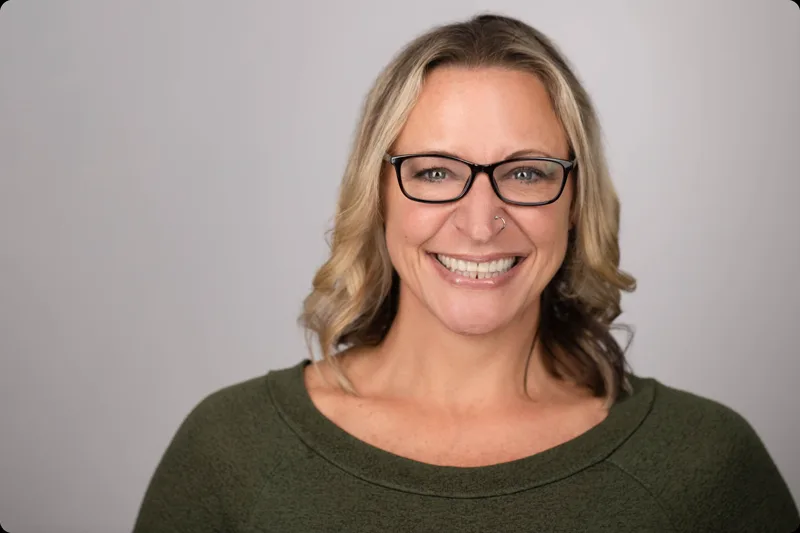 Clean professional headshot with soft studio lighting